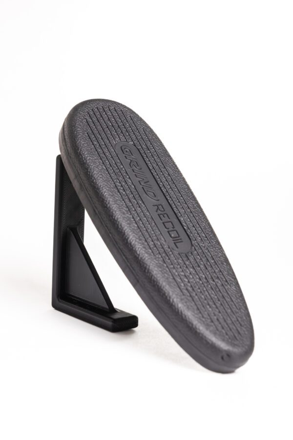 A black plastic object sitting on top of a table.