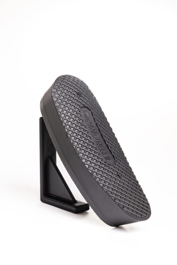 A black shoe on top of a white background.